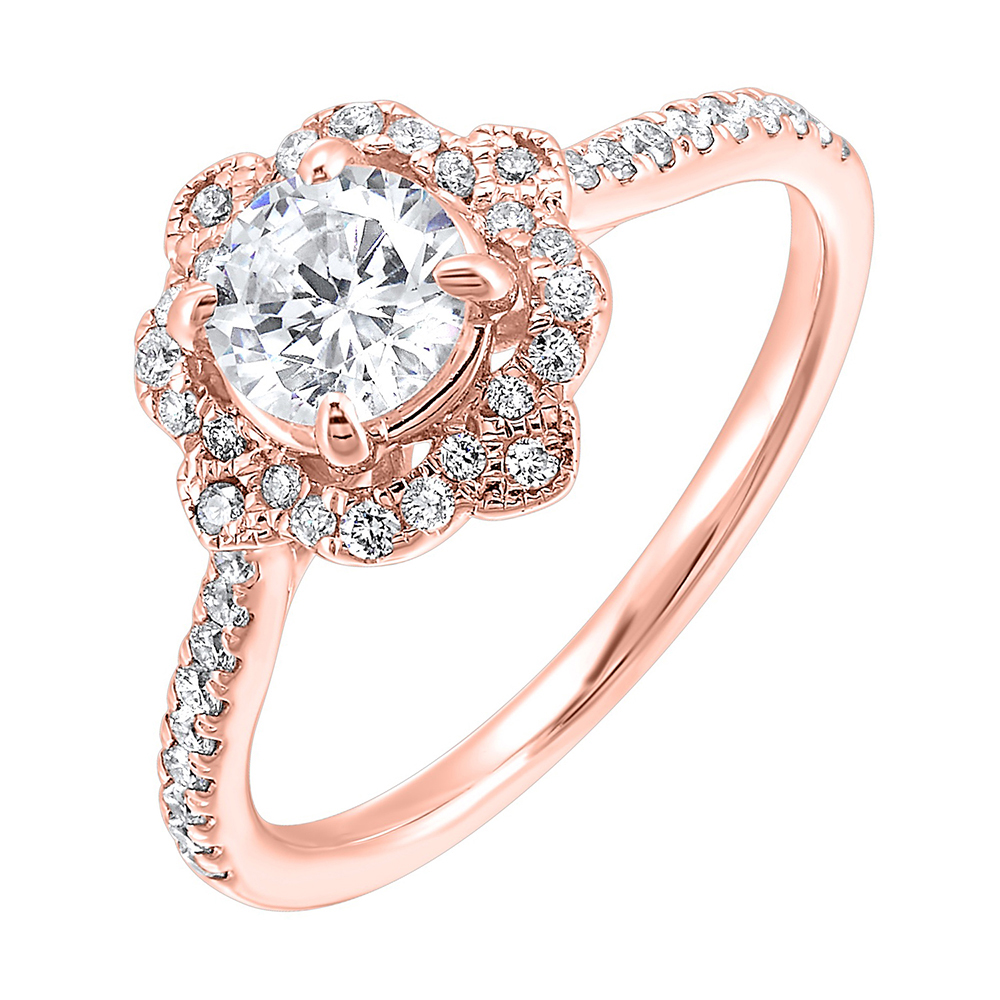 Floral halo with a clover air gap around center and delicate milgrain adds a vintage charm. It's adorned with pave set diamonds on the shank.