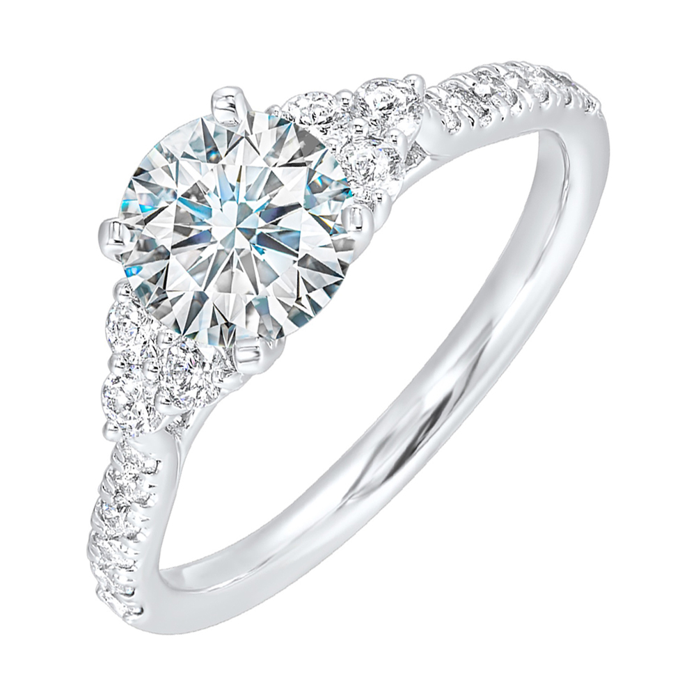 A trio of round diamonds on either side of the solitaire followed by a diamond studded shank, this ring is sure to impress her.