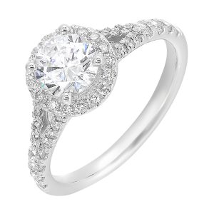 This ring stuns with a round solitaire embraced by a halo and a delicate split shank. It's a unique symbol of your love story.