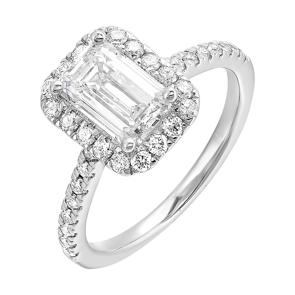 A beautiful emerald cut solitaire set with halo of round diamonds and a diamond studded shank makes this perfect choice of your love story.