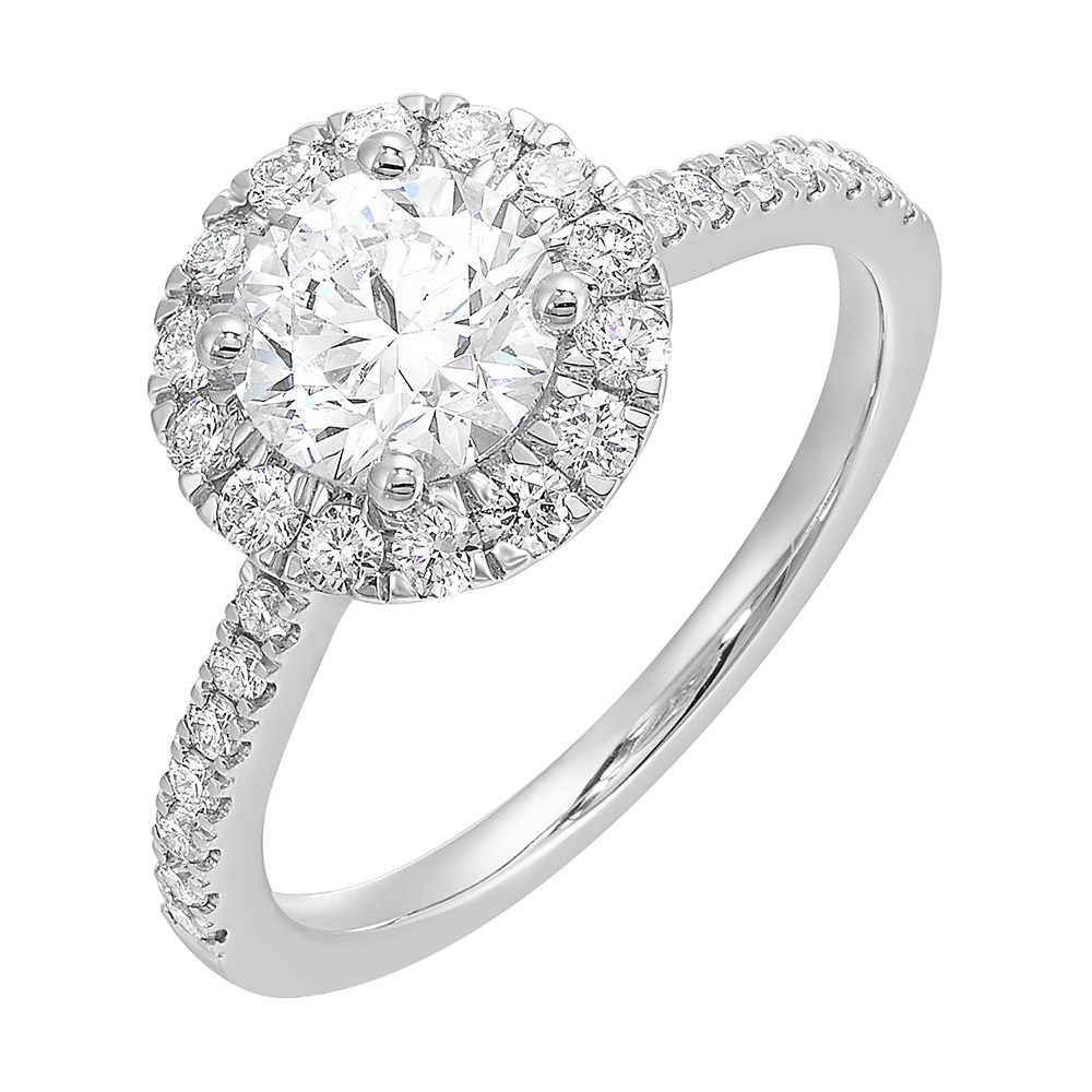Dazzle with classic round solitaire framed by a sparkling halo. The studded shank adds a touch of classic look, making this ring a timeless symbol of elegance.
