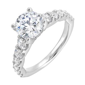 A classic round solitaire elevated by a graduating diamond shank set in common prong offers timeless elegance. Is perfect for your love story.