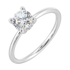 The dazzling solitaire diamond take center stage. The petite band adds to the sleek, classic look.