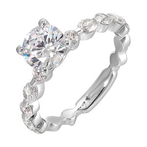 This trendy engagement ring features single prong diamonds set along the shank with stunning solitaire in center.