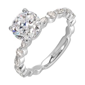 You are sure to cause a sensation with marqusie and round diamonds engagement ring highlighting the center solitaire.