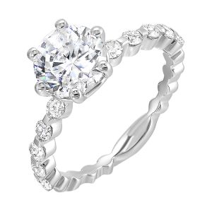 Clean and elegant with diamonds set in a single common prong along the shank shows off perfectly the center diamond set in 6 prong.