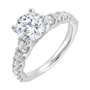 Dazzle with this gorgeous engagement ring featuring a round diamond center. The shank is graduated with large round diamonds, set in shared prongs.