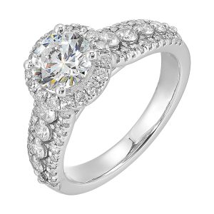 Halo shines with a stunning solitaire, embraced by luxurious three row shank tappering towards the bottom consisting of bigger diamonds in the center row is sure of a stunner.