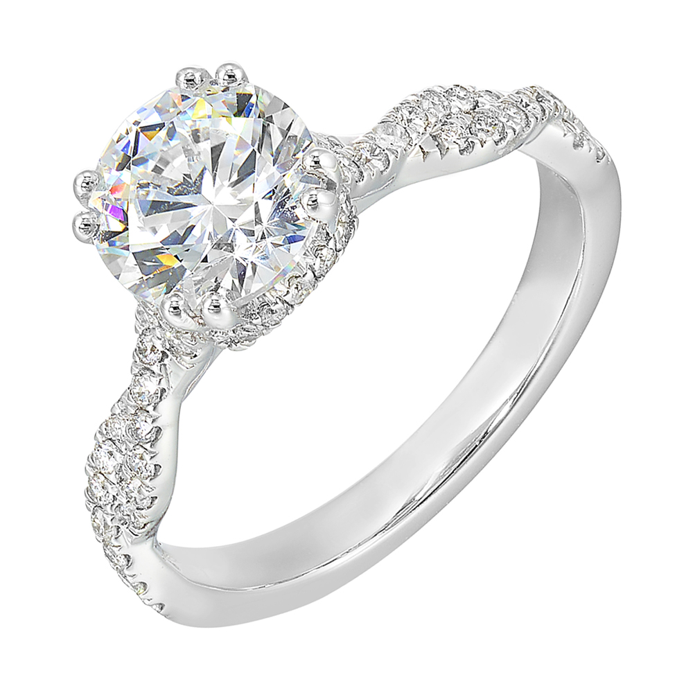 Stunning with a round solitaire diamond set in dual prongs atop a modern crisscross band. The unique twist on timeless elegance is perfect for the modern bride.