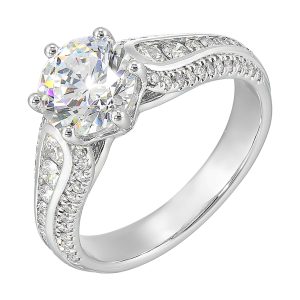 Stunning solitaire ring set in 6 prongs is a dazzling display of channel set diamonds in the center & pave on sides making the ring more appealing.
